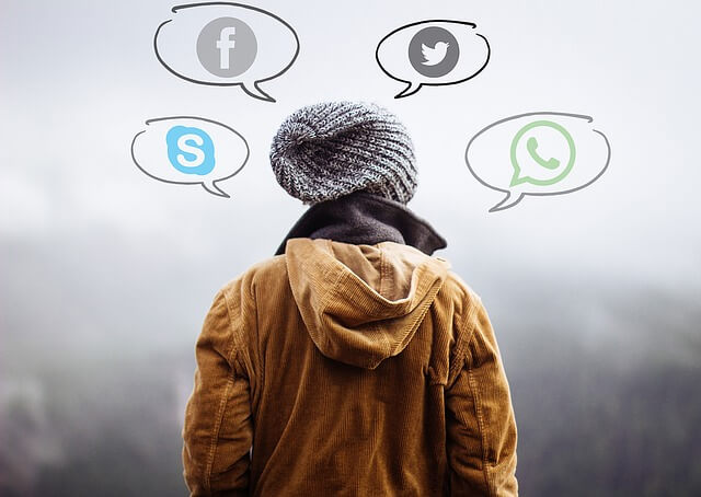 Human using mobile apps - WhatsApp, Twitter, Facebook and Skype