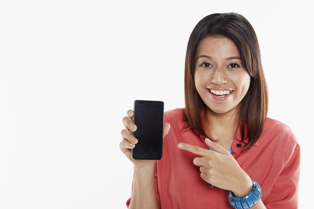 Woman holding up mobile phone. Buy a Smartphone on EMI without a Credit Card
