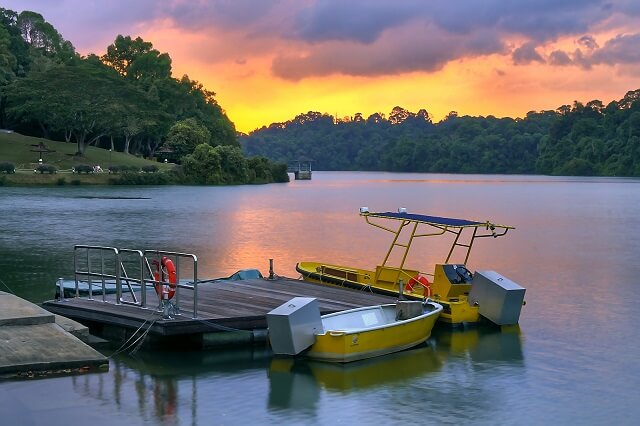 Boats at MacRitchie Reservoir, Singapore, at sunset﻿