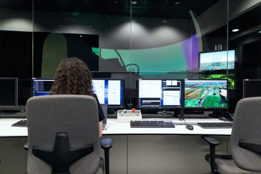 Airport Technology. Female Engineer Controlling Flight Simulator.