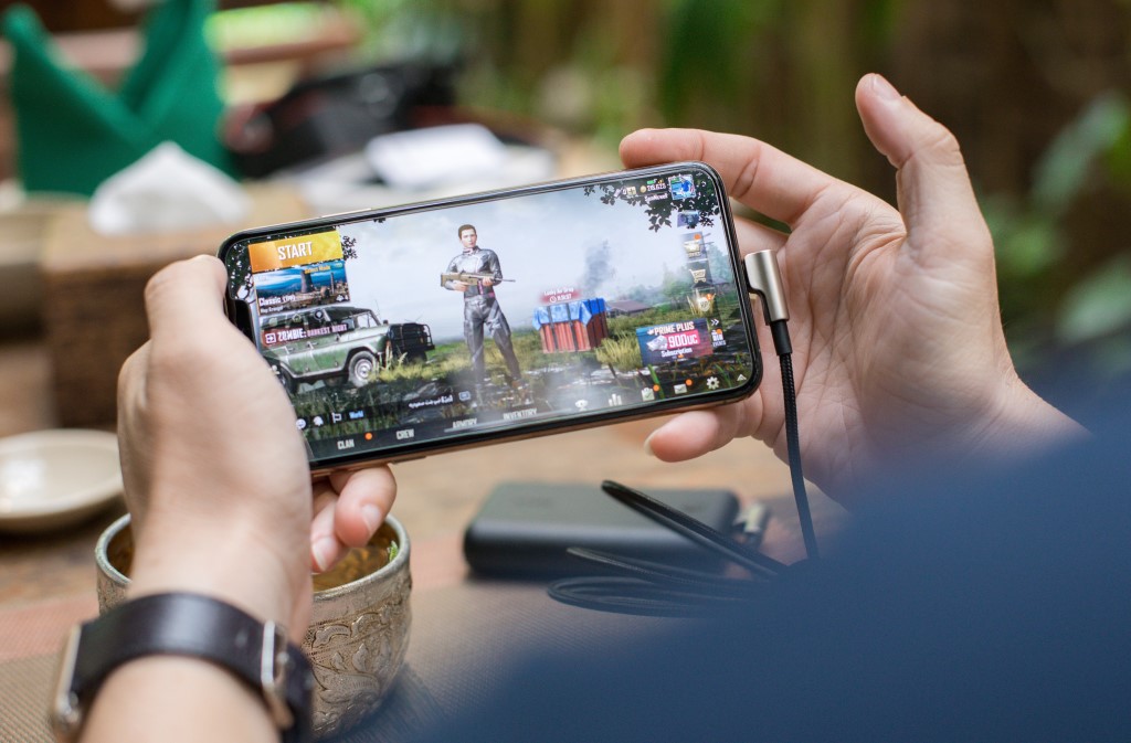 Mobile Gaming, Person Playing PUBG Game on Smartphone