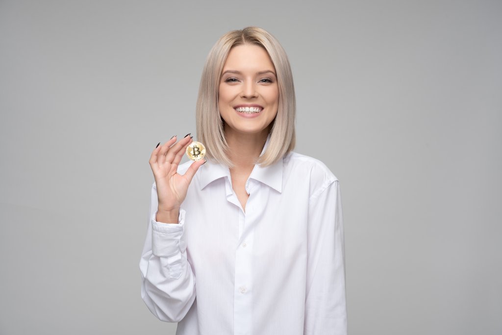 Women Holding Bitcoin Cryptocurrency