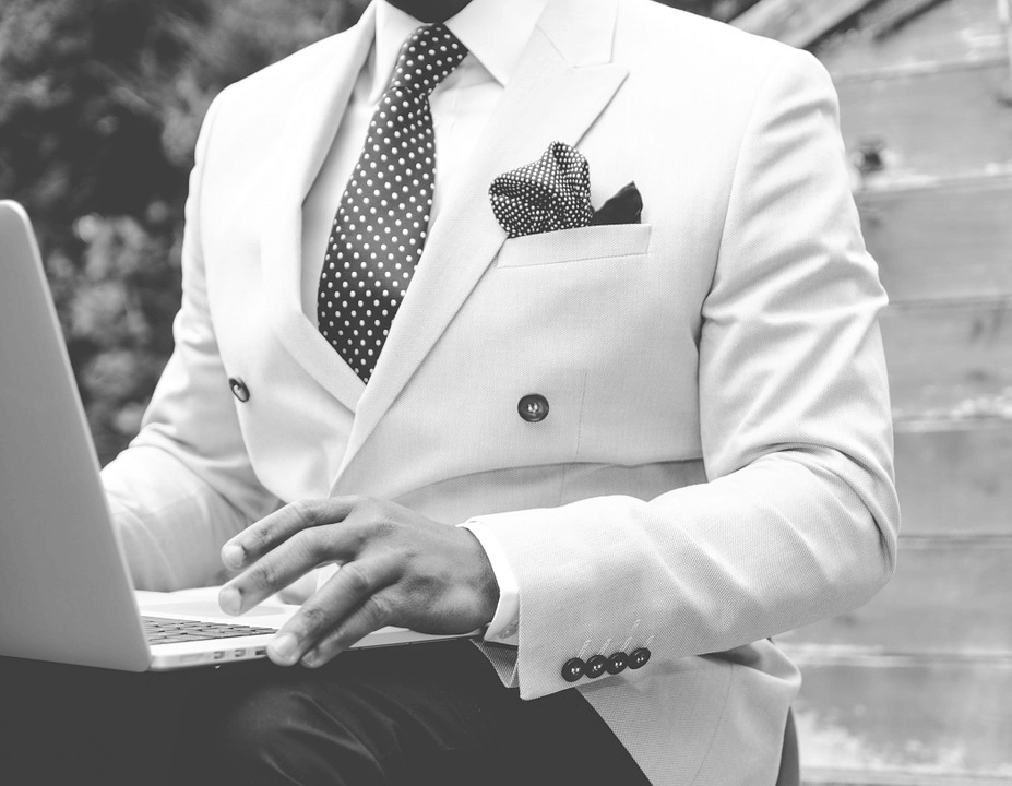 Man in Black and White Suit