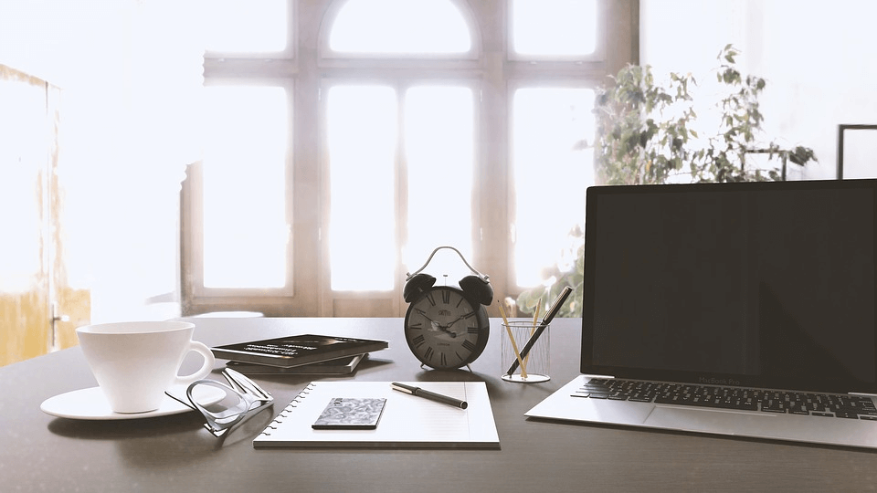 Work Desk With Laptop Computer, Alarm Clock.