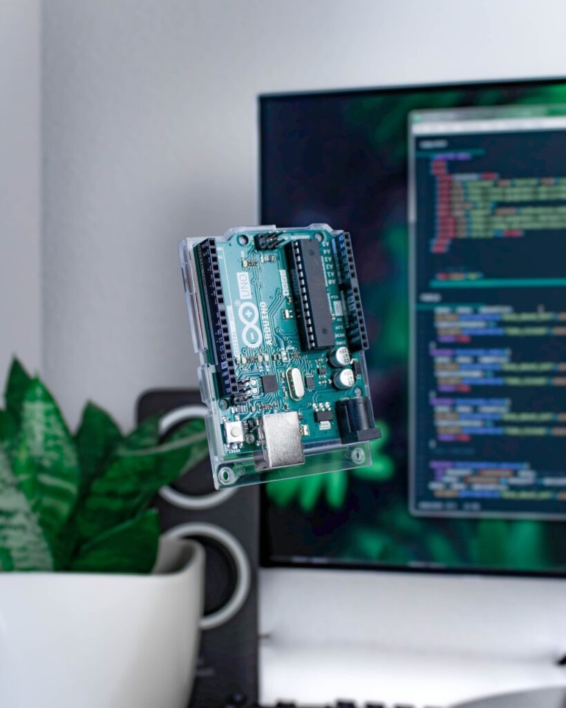 Arduino Board With Some Code in the Background