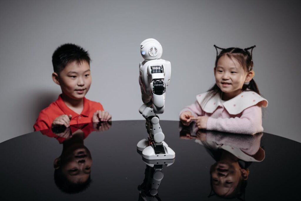A Young Girl and Boy Looking at the Robot