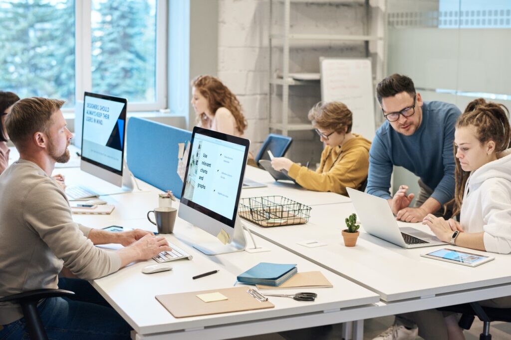 Workplace employees working in front of the computer