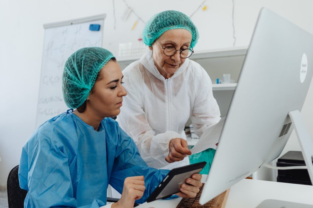 Medical Researchers, Medical Professionals Reading a Report