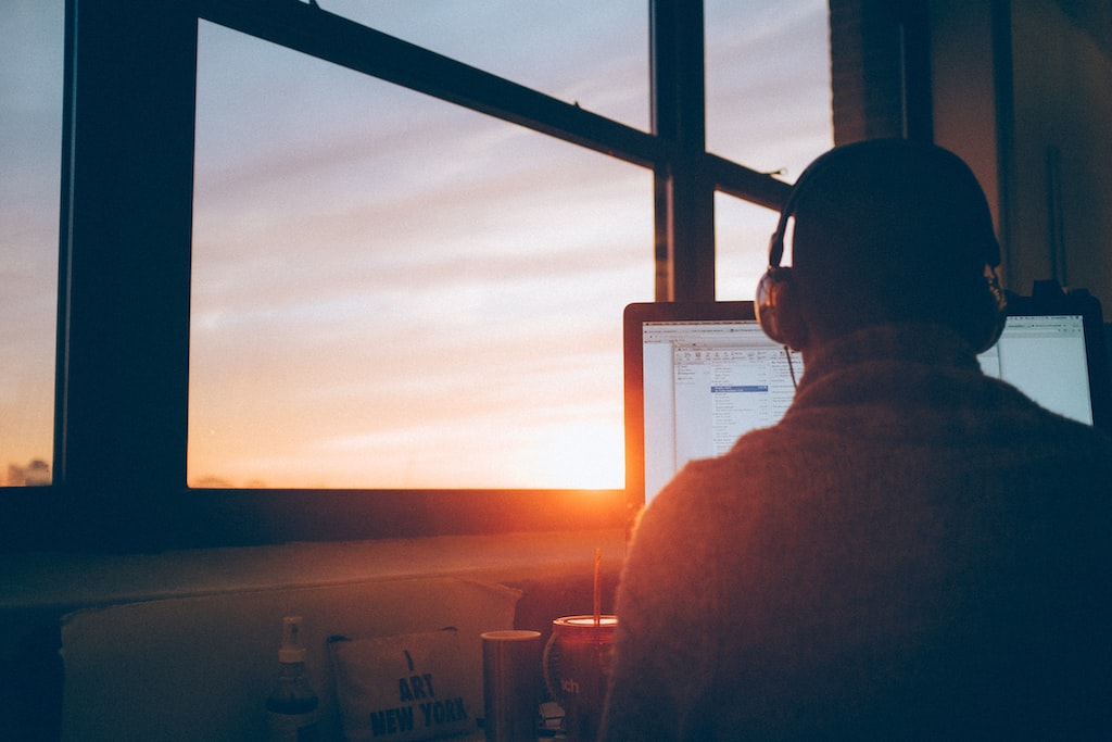 SEO Professional sitting facing monitor photo