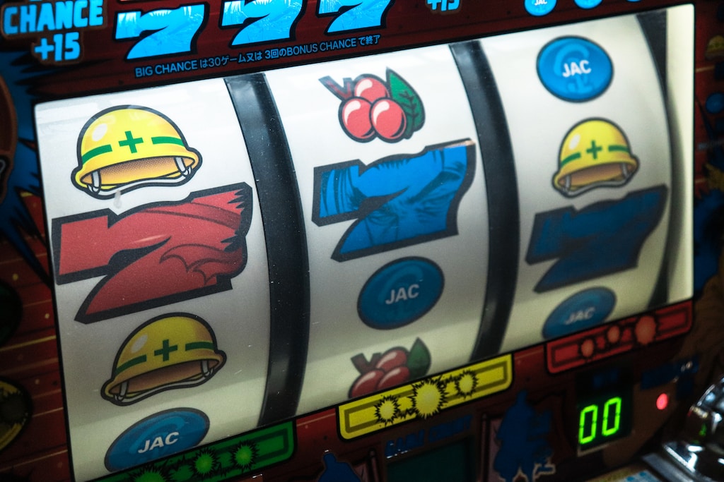 Slot machine displaying three seven photo