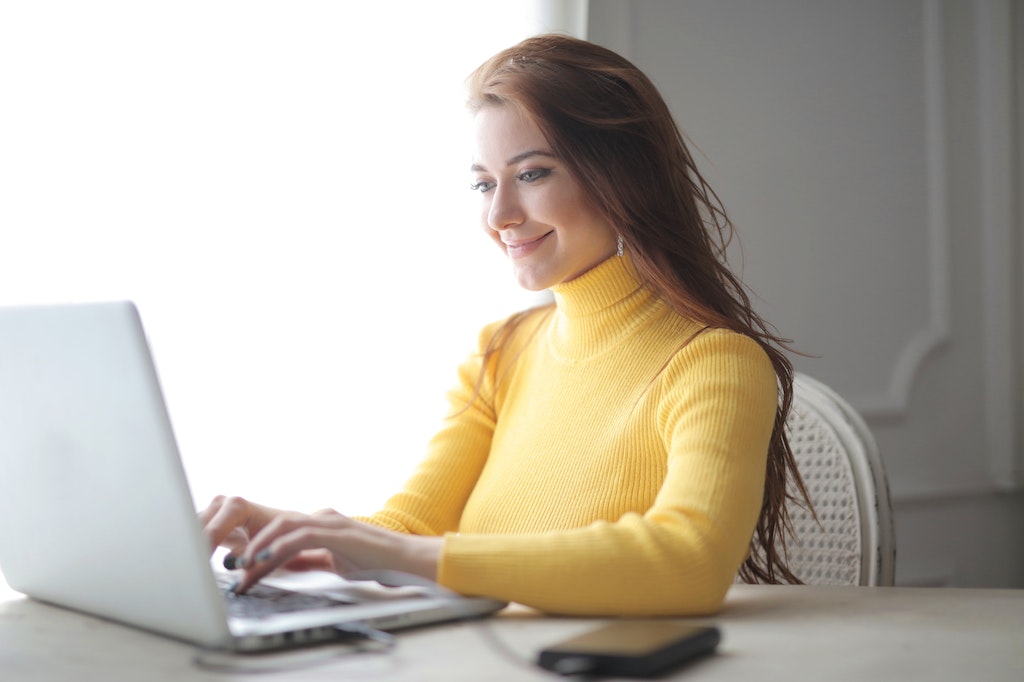 Virtual Office Assistant, Woman in Yellow Turtleneck Sweater Using Laptop, Remote Worker