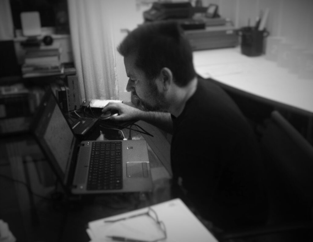 Architect working on laptop computer with CAD Design Software.
