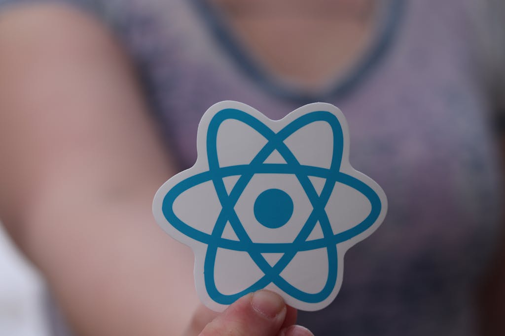 Hand Holding React Native Sticker, React Logo