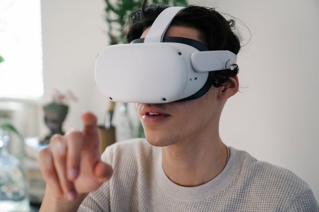 Young male interacting with virtual reality VR headset